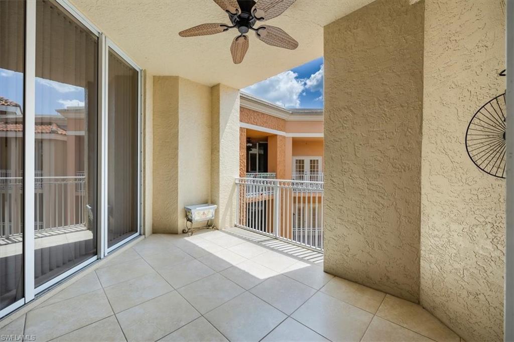 401 Bayfront Place, Unit 3509 Naples, FL 34102 - Photo 11 of 21 a view of a livingroom with a chandelier fan and windows