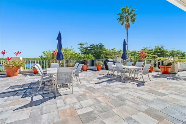 a terrace with a table and chairs