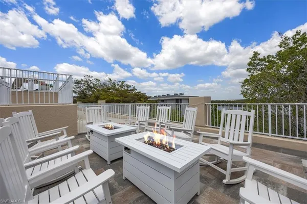 a swimming pool with outdoor seating and yard
