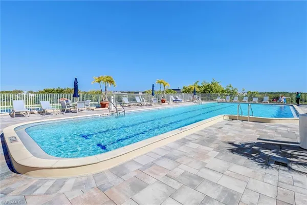 a view of swimming pool with chairs