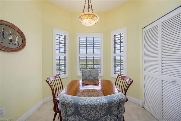 a dining room with furniture and window