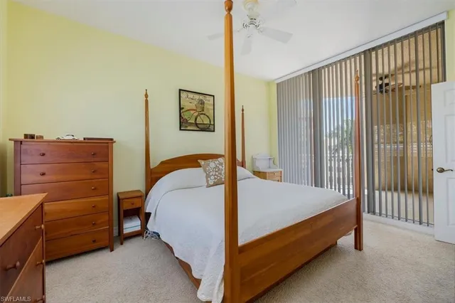 a bedroom with a bed and a tv