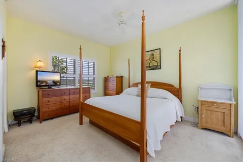 a bathroom with a granite countertop sink mirror and toilet