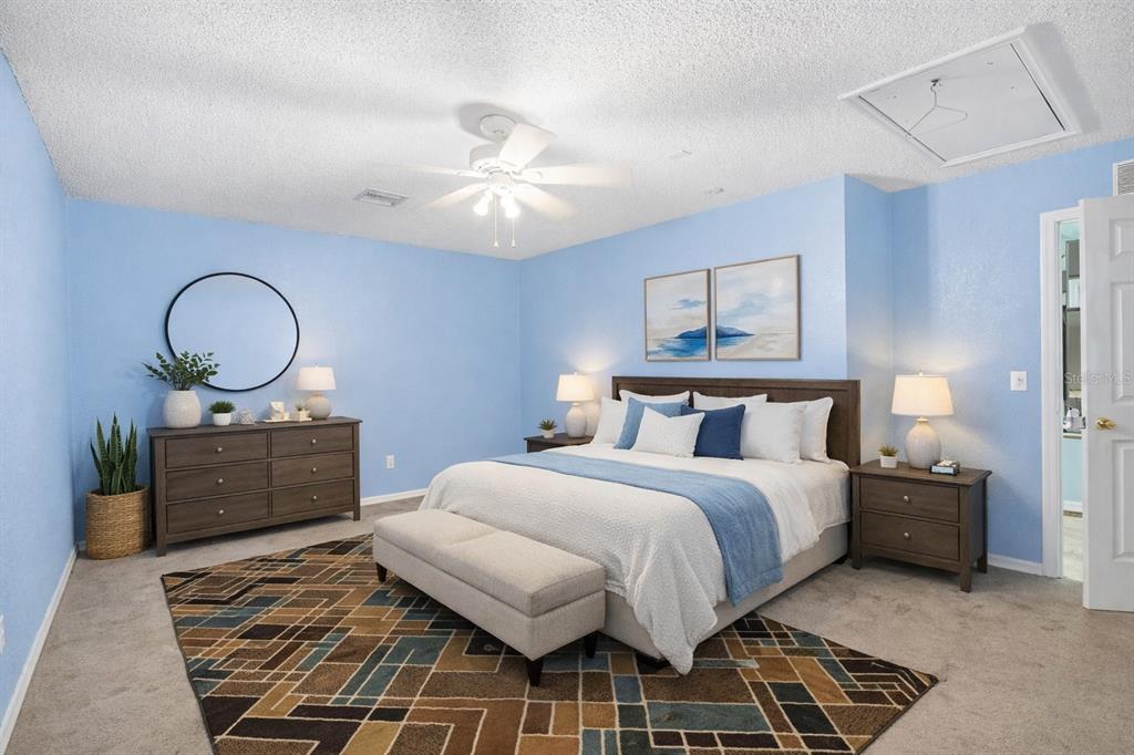 1071 Angora Street Deltona, FL 32725 - Photo 18 of 45 a bedroom with a bed and a chandelier