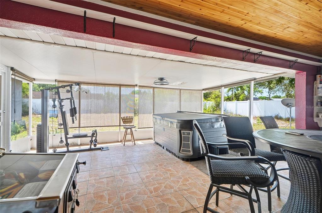 1071 Angora Street Deltona, FL 32725 - Photo 21 of 45 a dining room with furniture and large windows