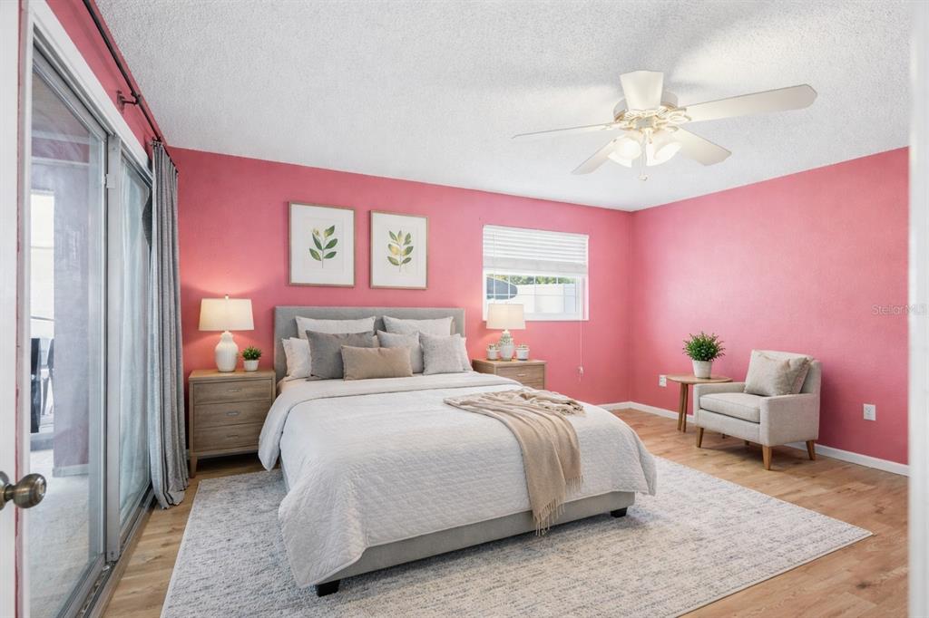 1071 Angora Street Deltona, FL 32725 - Photo 22 of 45 a bedroom with a bed and a chandelier