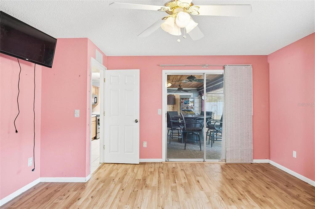 1071 Angora Street Deltona, FL 32725 - Photo 23 of 45 a view of a livingroom with wooden floor and cabinet