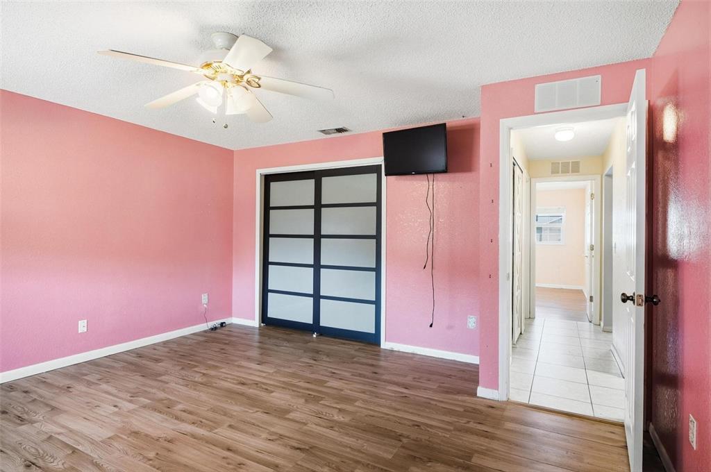 1071 Angora Street Deltona, FL 32725 - Photo 24 of 45 wooden floor in an empty room with a mirror