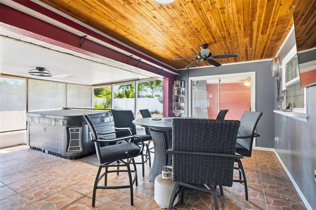 1071 Angora Street Deltona, FL 32725 - Photo 27 of 45 a dining room with furniture a rug and wooden floor