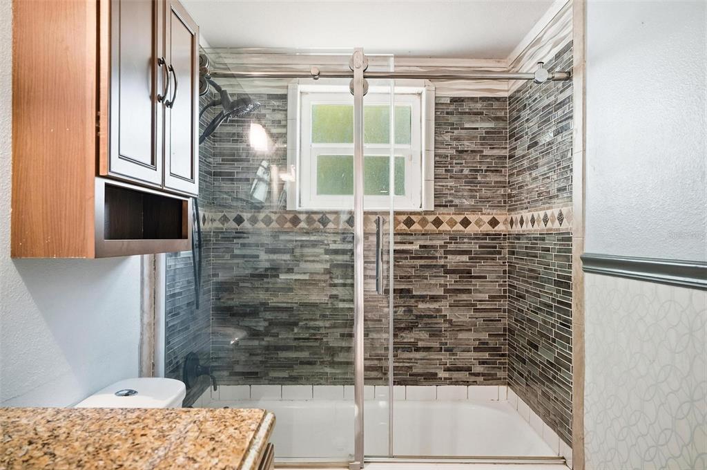 1071 Angora Street Deltona, FL 32725 - Photo 32 of 45 a bathroom with a shower