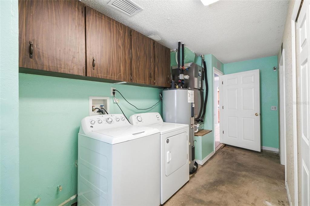 1071 Angora Street Deltona, FL 32725 - Photo 33 of 45 a utility room with dryer and washer