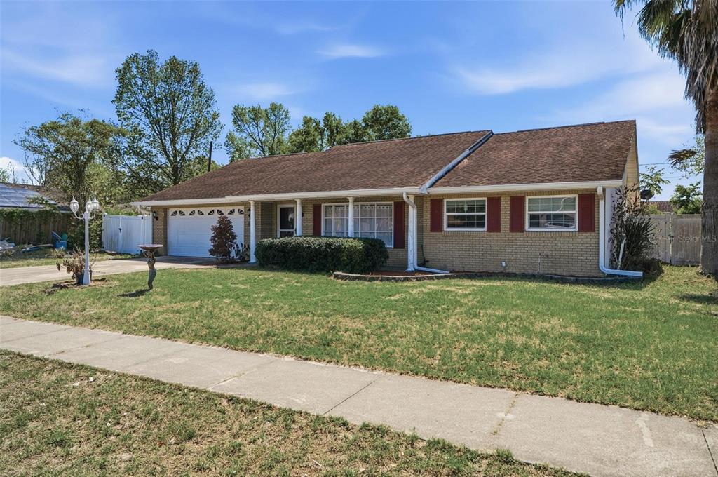 1071 Angora Street Deltona, FL 32725 - Photo 38 of 45 front view of house with a yard