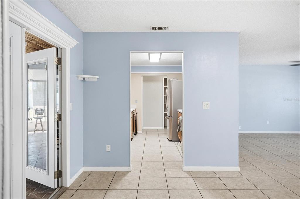 1071 Angora Street Deltona, FL 32725 - Photo 4 of 45 a view of a livingroom with a tub and closet area
