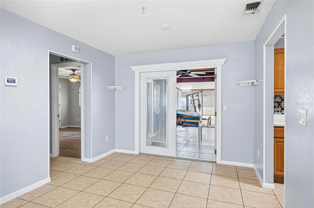 1071 Angora Street Deltona, FL 32725 - Photo 8 of 45 a view of a hallway view with wooden floor and windows