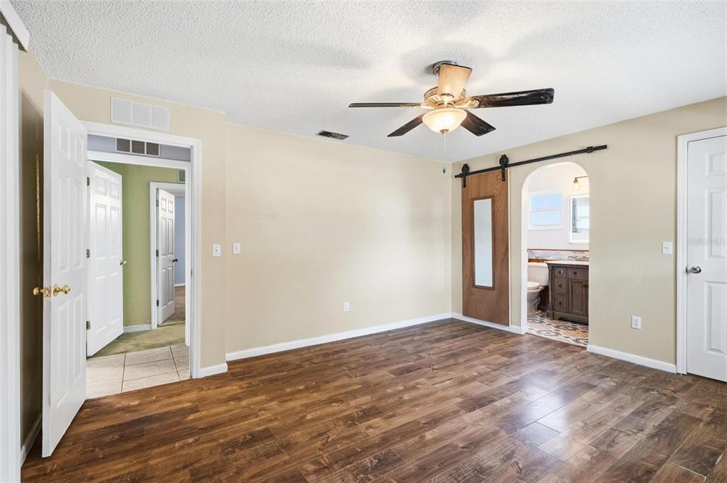 1071 Angora Street Deltona, FL 32725 - Photo 10 of 45 a view of empty room with a ceiling fan and window