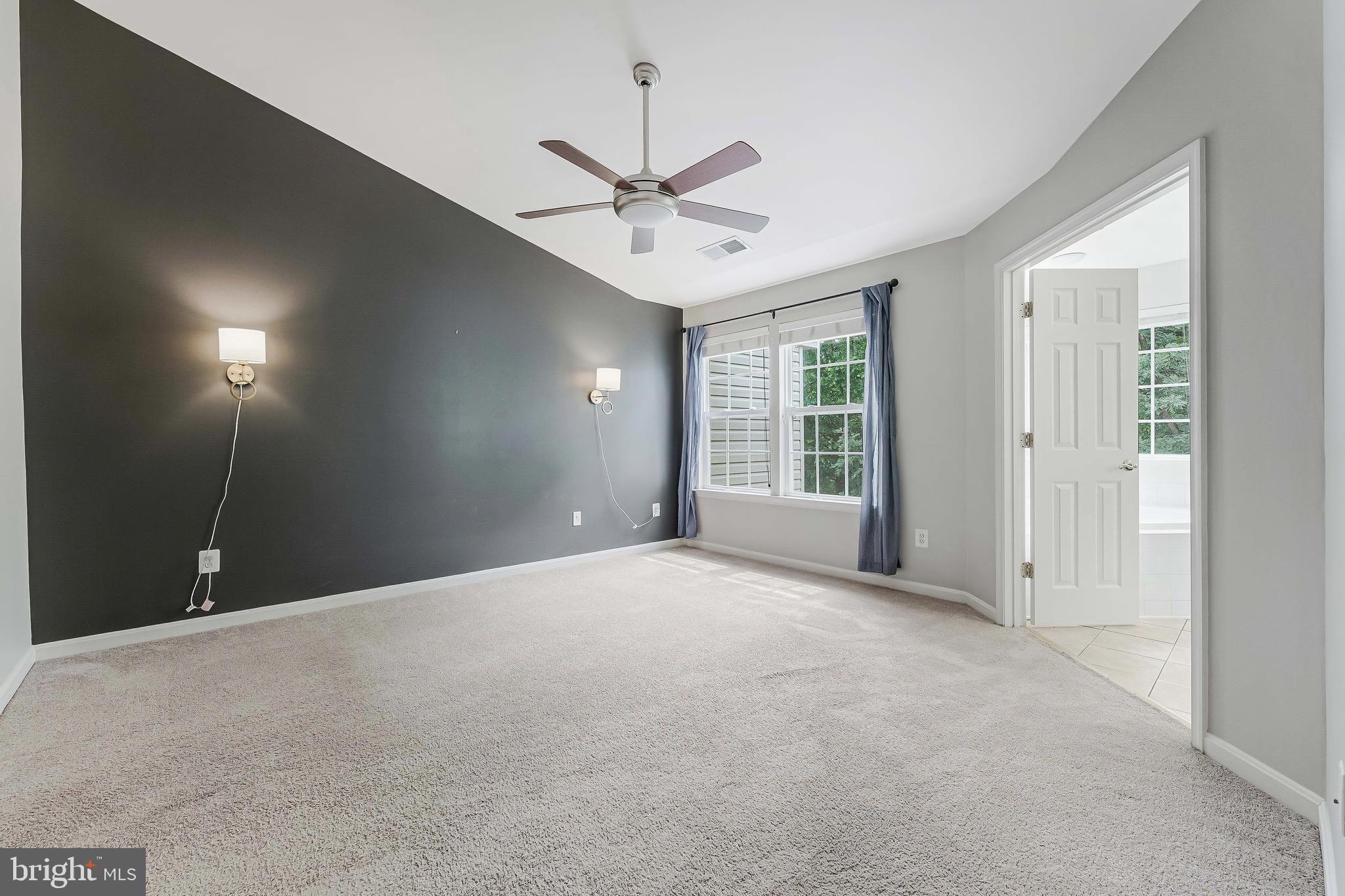 43103 Forest Edge Square Broadlands, VA 20148 - Photo 29 of 57 an empty room with fan and windows
