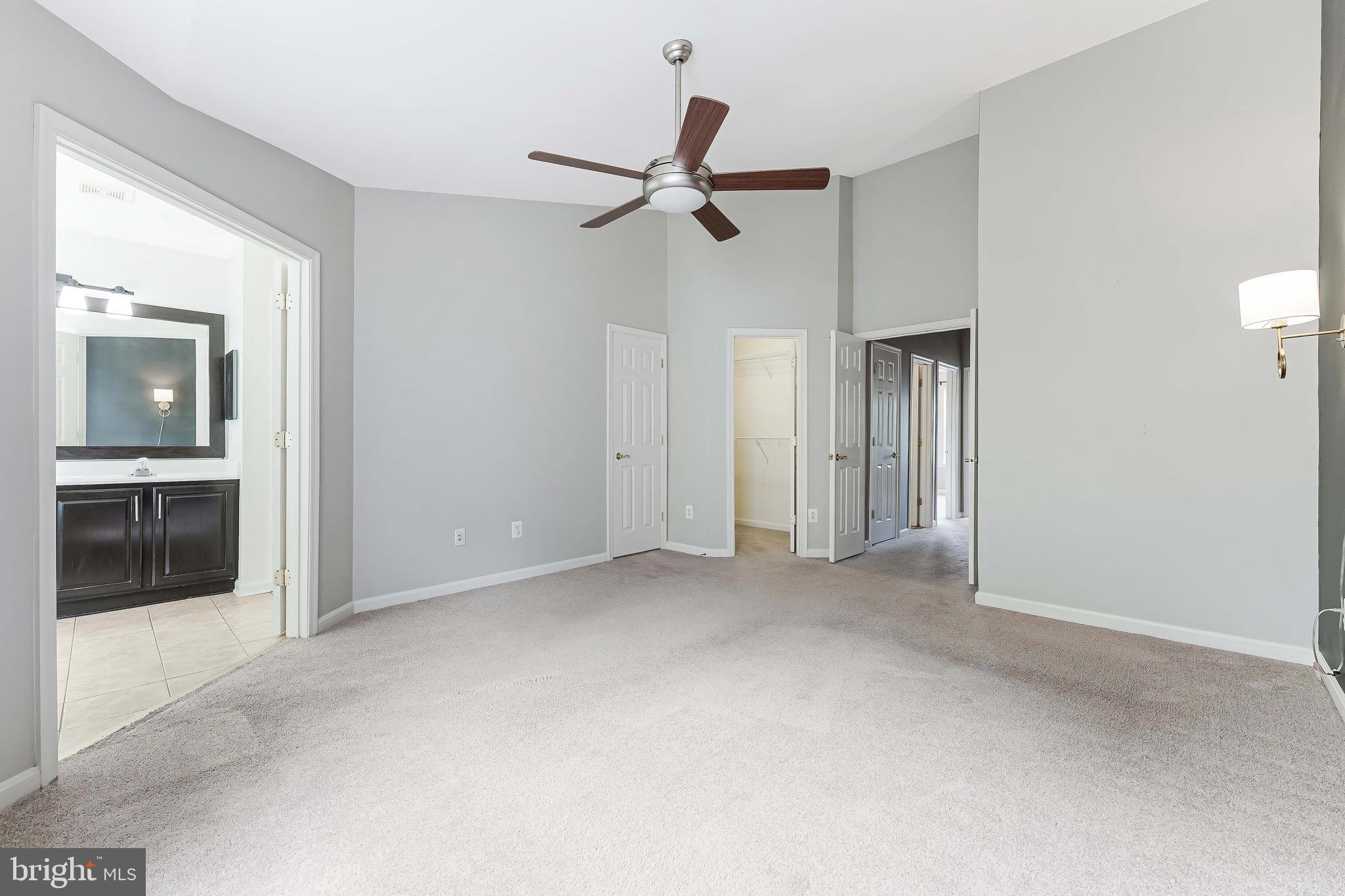43103 Forest Edge Square Broadlands, VA 20148 - Photo 31 of 57 a view of empty room with wooden floor and ceiling fan