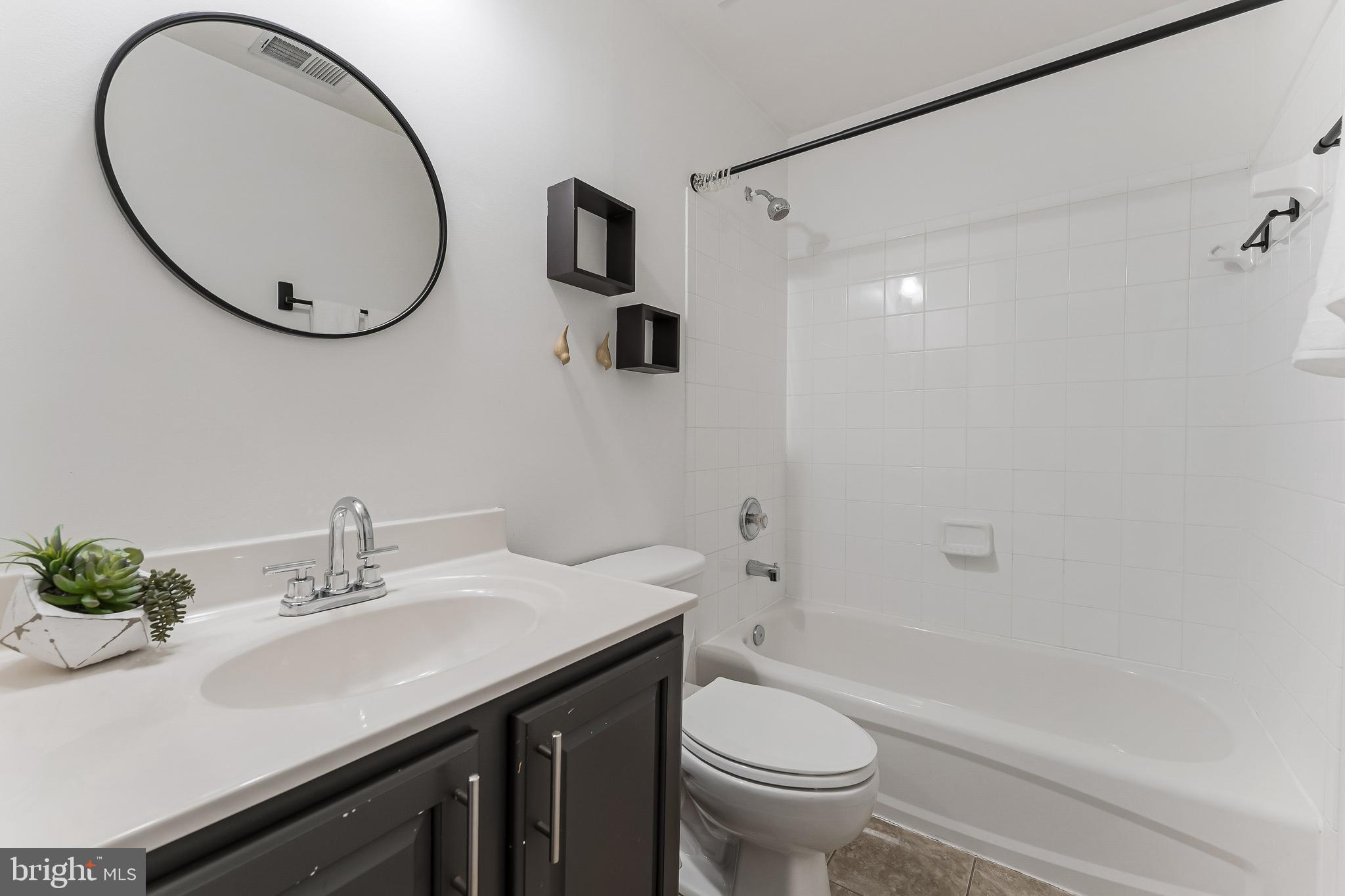 43103 Forest Edge Square Broadlands, VA 20148 - Photo 44 of 57 a bathroom with a sink and a mirror
