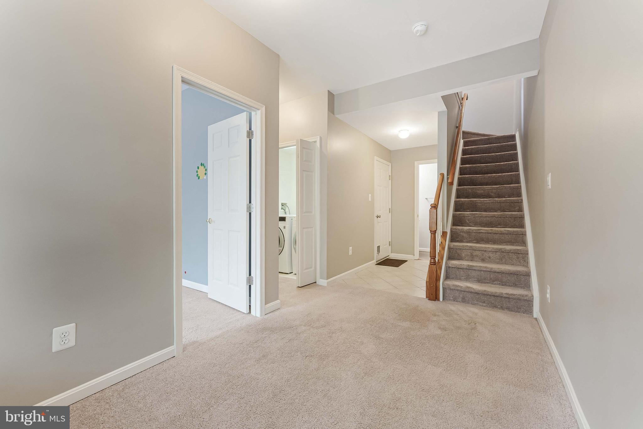 43103 Forest Edge Square Broadlands, VA 20148 - Photo 45 of 57 a view of room with stairs and a hallway