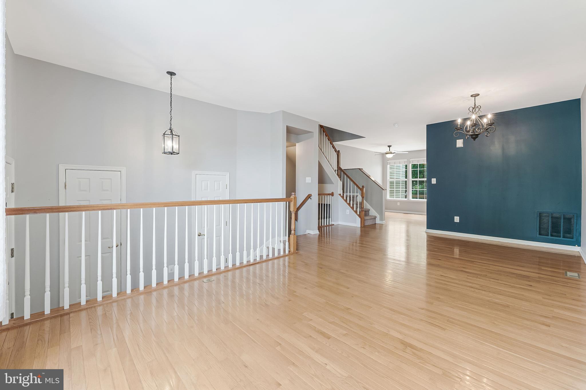 43103 Forest Edge Square Broadlands, VA 20148 - Photo 10 of 57 a view of a hallway with wooden floor