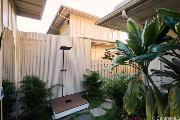 a view of a house with a small yard