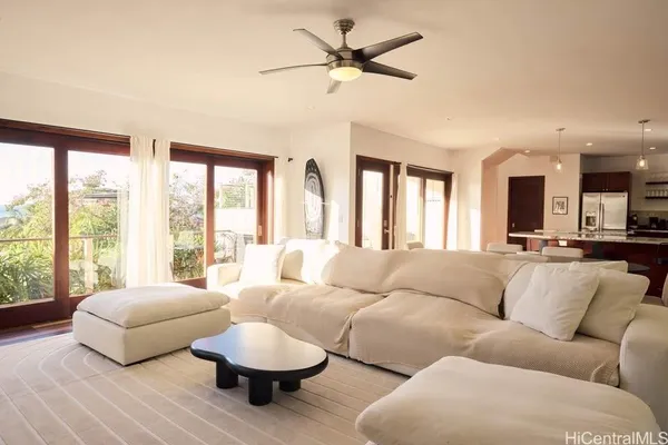 a living room with furniture and a large window
