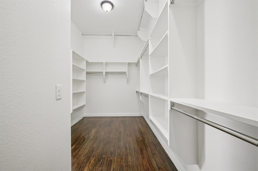 2029 Temperate Drive Allen, TX 75013 - Photo 16 of 40 a view of walk in closet with empty racks