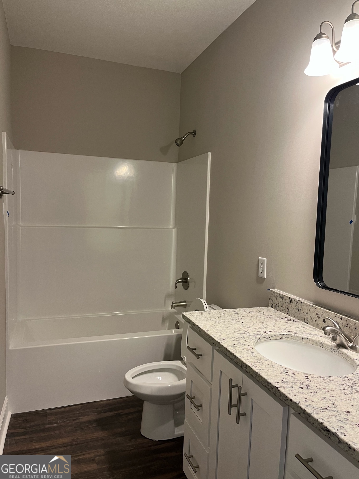 129 Orchard Way Brooklet, GA 30415 - Photo 6 of 15 a bathroom with a granite countertop sink toilet and shower