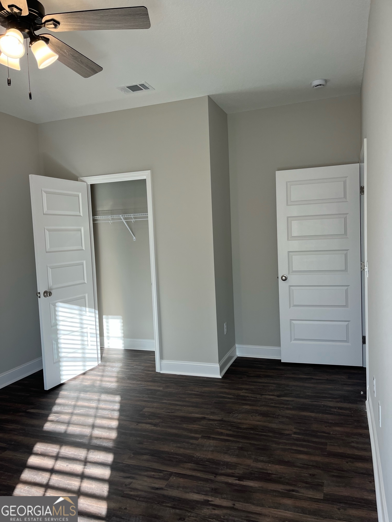 129 Orchard Way Brooklet, GA 30415 - Photo 8 of 15 a view of empty room with window and wooden floor