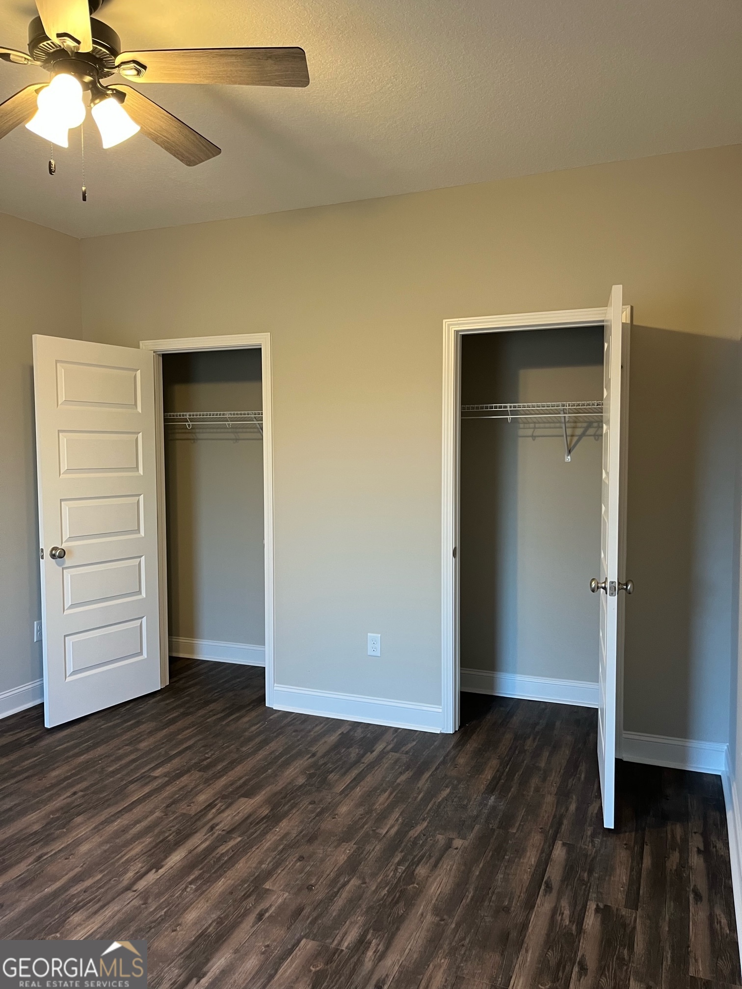 129 Orchard Way Brooklet, GA 30415 - Photo 10 of 15 an empty room with wooden floor closet and windows