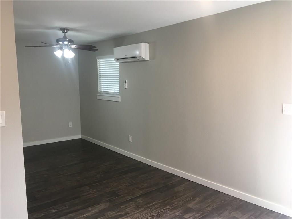225 West N Loop Boulevard, Unit 201 Austin, TX 78751 - Photo 6 of 6 a view of an empty room with wooden floor