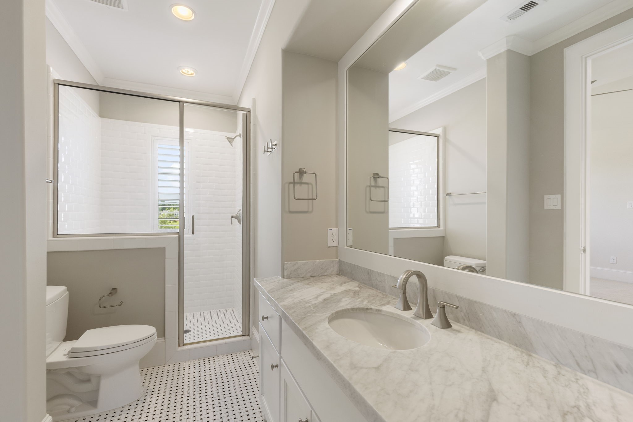 6806 West Warwick Lake Lane Spring, TX 77389 - Photo 35 of 50 a bathroom with a granite countertop sink a toilet and a large mirror