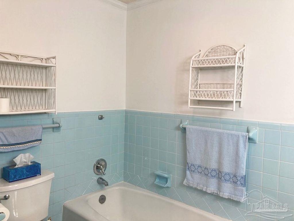 9870 Highway 31 Atmore, AL 36502 - Photo 19 of 31 a bathroom with a window a sink and a toilet