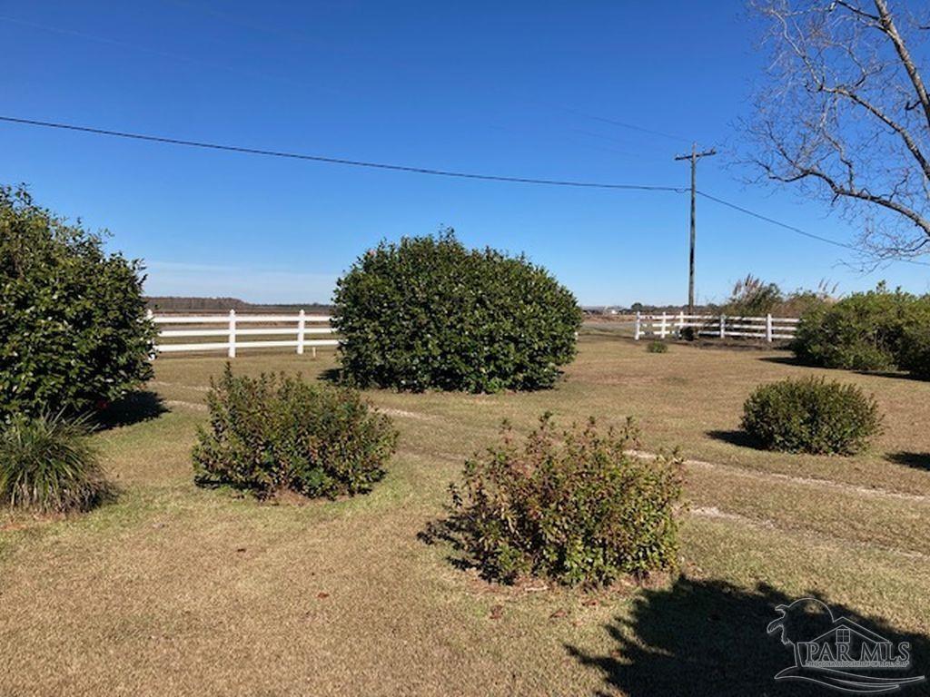 9870 Highway 31 Atmore, AL 36502 - Photo 29 of 31 a view of a road with a building in the background