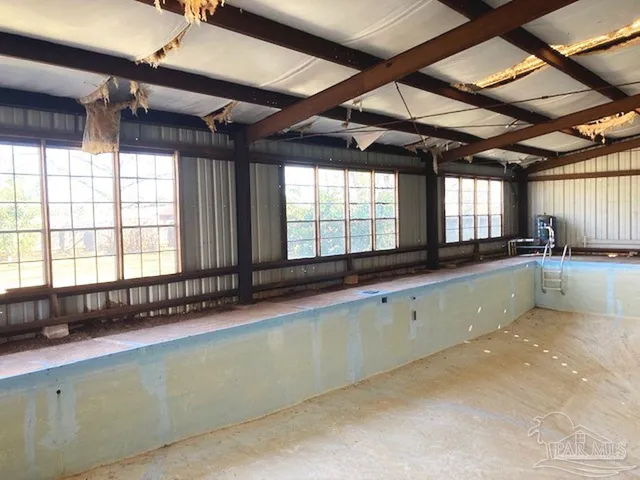 a large room with lots of windows and dryer