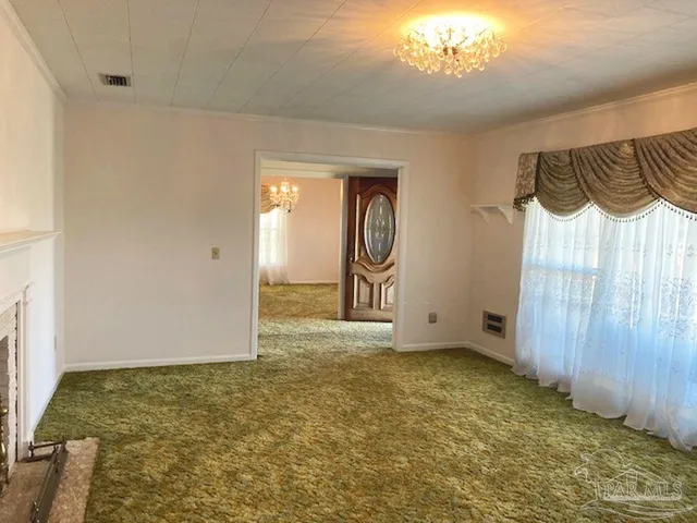 a view of an empty room and window