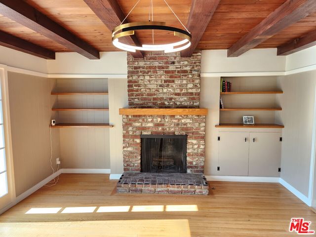 a view of livingroom with furniture and fireplace