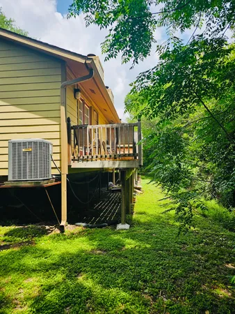 a view of house with backyard