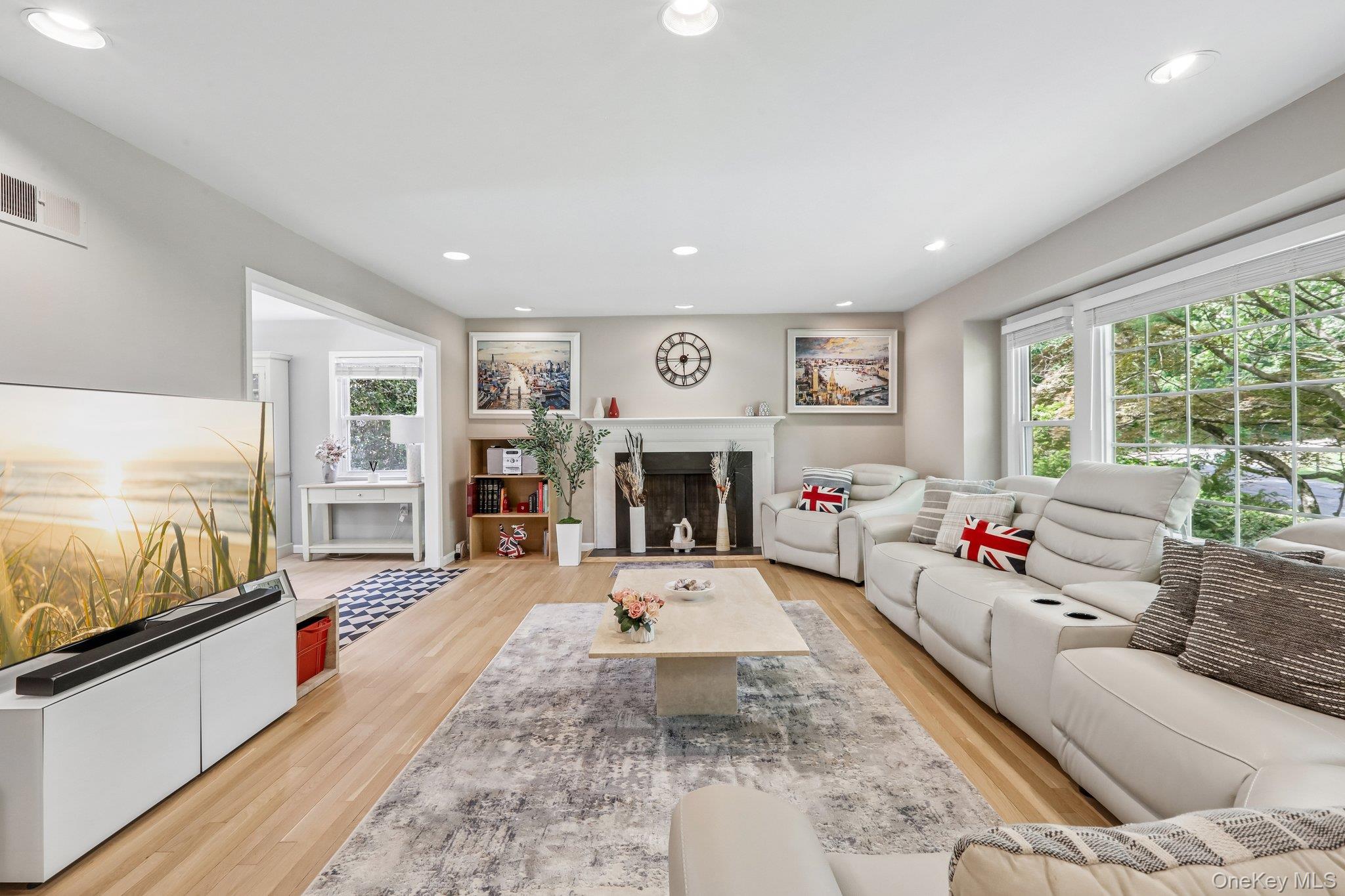 62 Mohegan Road Larchmont, NY 10538 - Photo 12 of 46 a living room with furniture and a fireplace