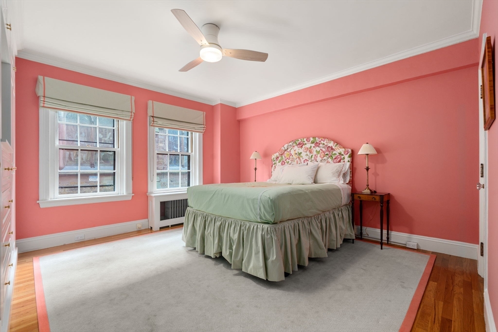 50 Commonwealth Avenue, Unit 204 Boston, MA 02116 - Photo 14 of 21 a spacious bedroom with a bed and a cabinets