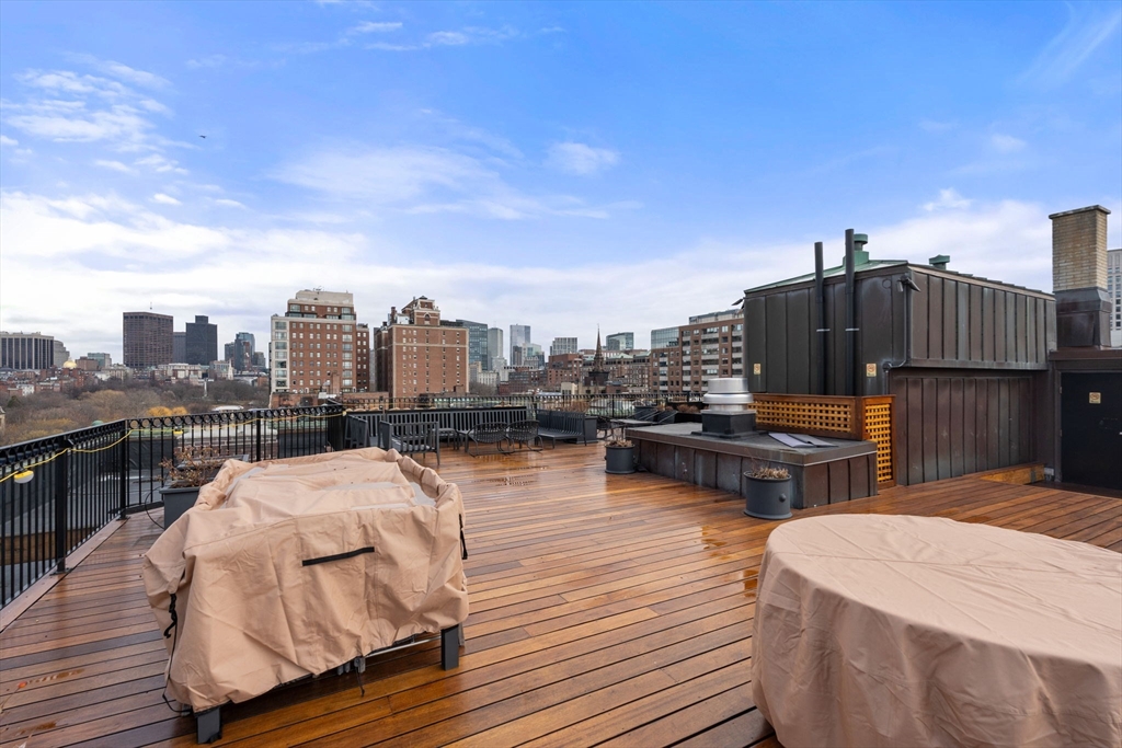 50 Commonwealth Avenue, Unit 204 Boston, MA 02116 - Photo 19 of 21 a view of a roof deck with wooden floor and seating space