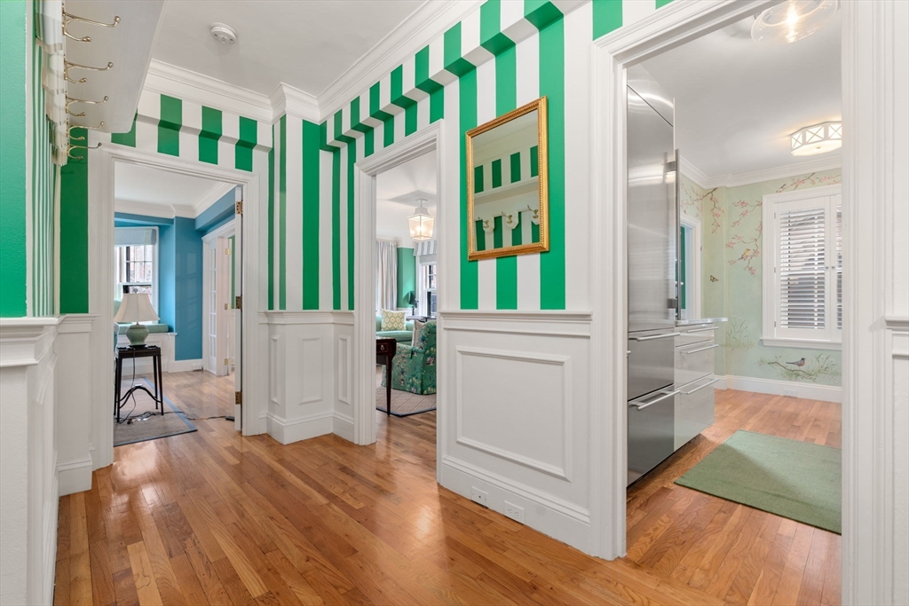50 Commonwealth Avenue, Unit 204 Boston, MA 02116 - Photo 2 of 21 a view of a hallway with dining room and mirror
