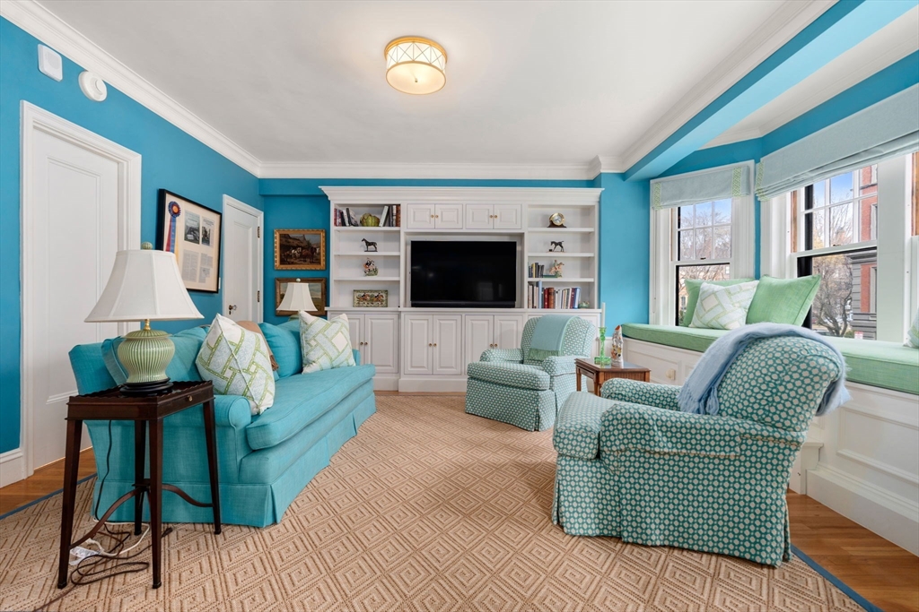 50 Commonwealth Avenue, Unit 204 Boston, MA 02116 - Photo 4 of 21 a living room with furniture and a flat screen tv