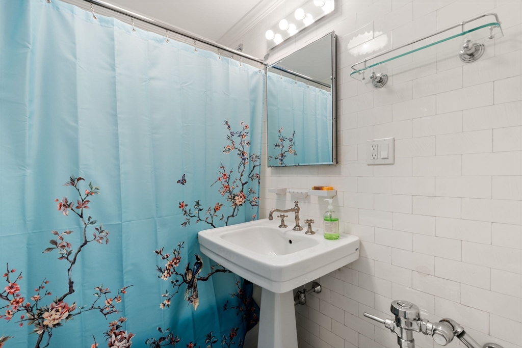 50 Commonwealth Avenue, Unit 204 Boston, MA 02116 - Photo 6 of 21 a bathroom with a sink and mirror