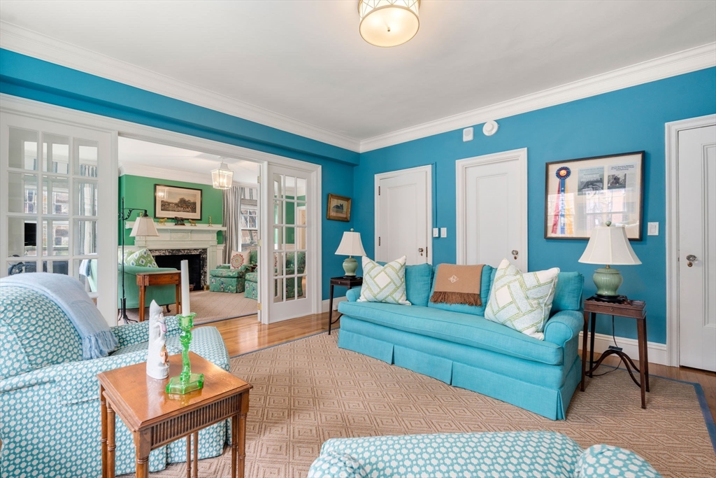 50 Commonwealth Avenue, Unit 204 Boston, MA 02116 - Photo 7 of 21 a living room with furniture and a fireplace