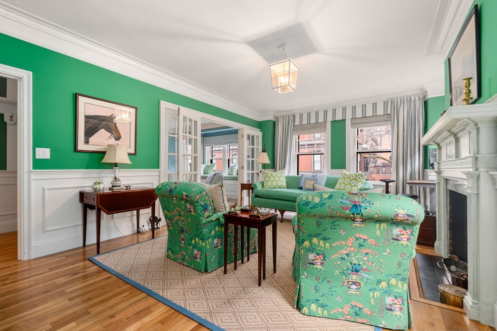 50 Commonwealth Avenue, Unit 204 Boston, MA 02116 - Photo 9 of 21 a living room filled with furniture hardwood floor and a fireplace