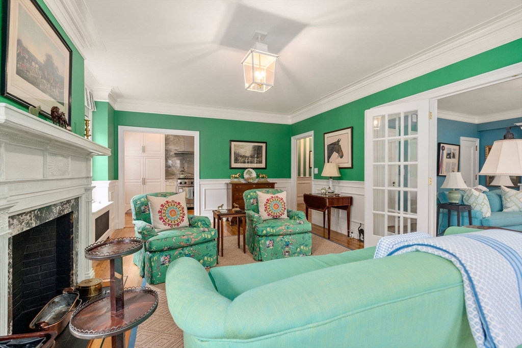 50 Commonwealth Avenue, Unit 204 Boston, MA 02116 - Photo 10 of 21 a living room with furniture a fireplace and a flat screen tv