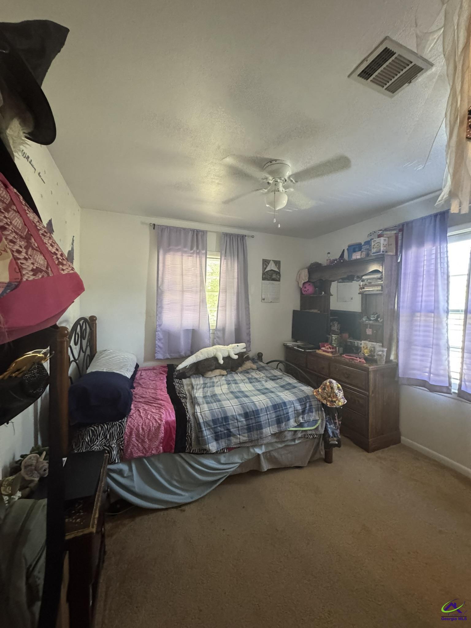 1032 Elberta Road Warner Robins, GA 31093 - Photo 18 of 26 a bedroom with bed and window