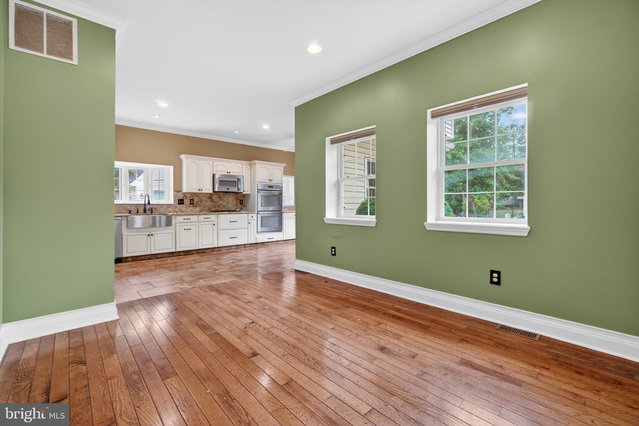 117 State Avenue Lindenwold, NJ 08021 - Photo 17 of 58 a view of a kitchen and an empty room with wooden floor