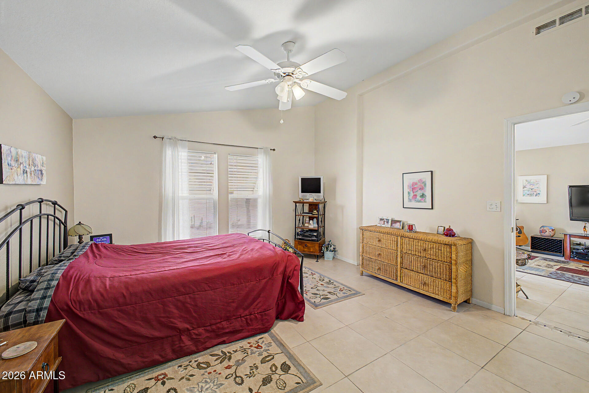 2101 South Meridian Road, Unit 45 Apache Junction, AZ 85120 - Photo 15 of 36 a bedroom with a bed and dresser